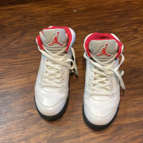 fire red jordan 5 on feet